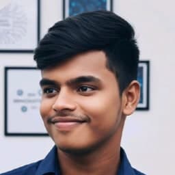 Revanth Kumar, smiling, in a navy shirt.